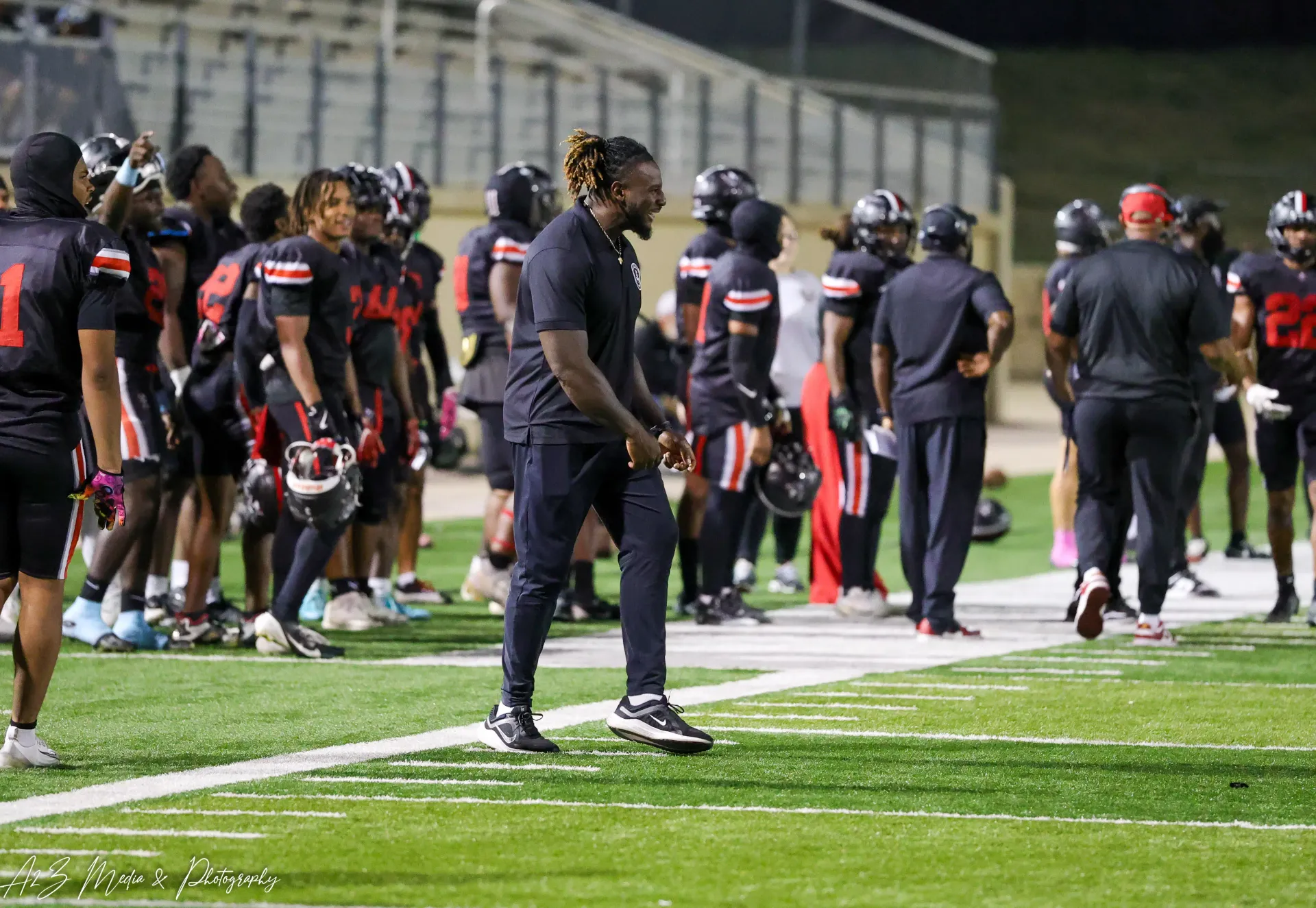 Texas Spartans football team gathered on the sideline